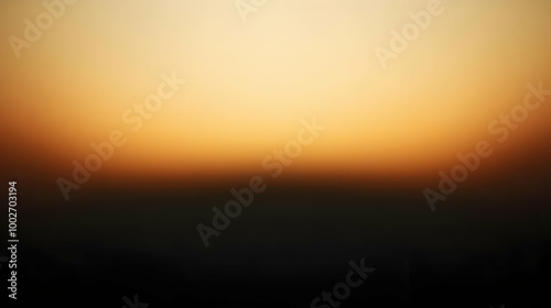 Blurred gradient black to ochre abstract background