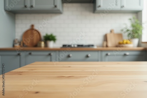 Modern kitchen interior with wooden countertop and grey cabinets.