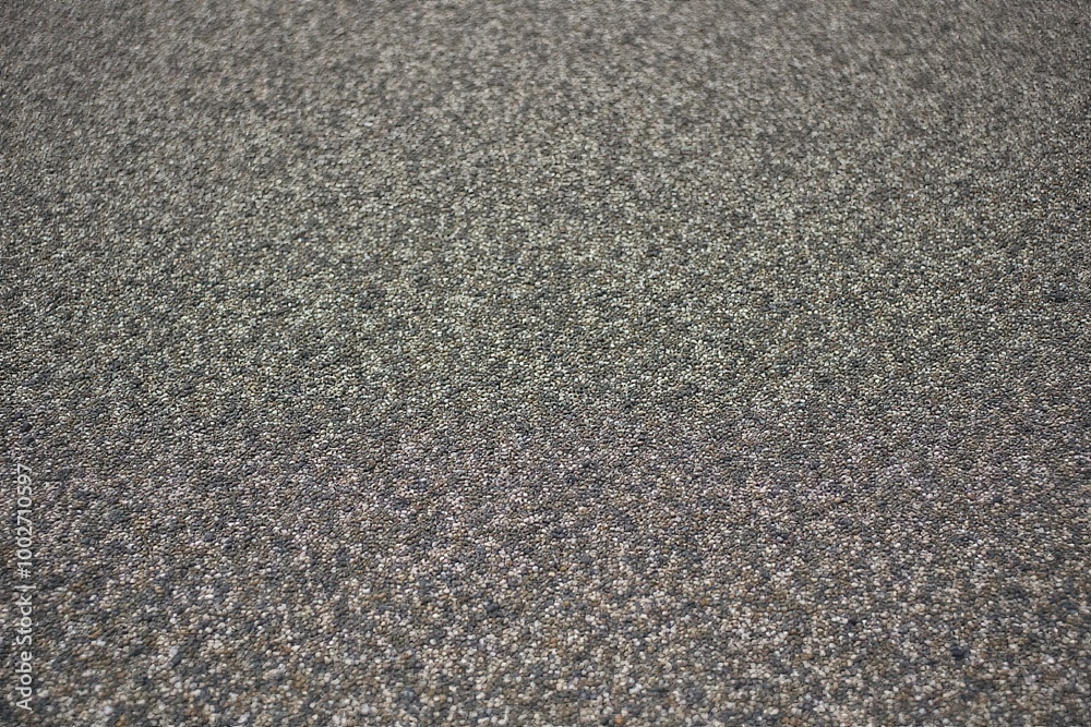 Textured gray asphalt surface for urban road design and background concepts. Textured gray asphalt surface for urban road design and background concepts.