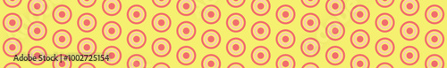 A vibrant pattern featuring concentric ovals in pink and cream against a yellow background, ideal for textile or graphic design.