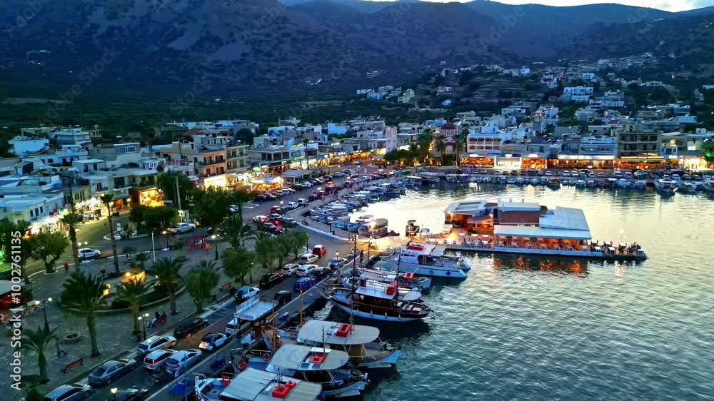 Iconic Elounda port of Crete island during sunset, aerial view