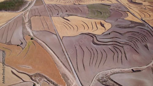 4k cinematic drone. The Monegros Desert is a semi-desert in Aragón. with yellow amazing landscapes. It is noted for its annual electronic music festival held July, the Monegros Festival. photo