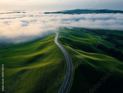 Aerial view of a highway winding through rolling green hills, soft morning fog, Highway landscape, Aerial rural highway photo