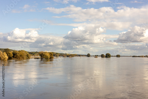 Landscape of the picturesquely spread Odra River on the Polish-German border. Concept. Threat and beauty of nature