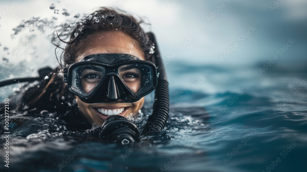 Portrait of a smiling female with scuba diving gear in sea water Portrait of a smiling female with scuba diving gear in sea water