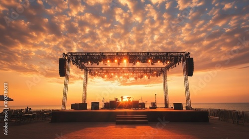 An outdoor concert stage set up at sunset, no audience, ample copy space for branding
