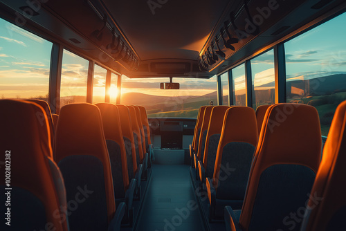 Empty bus interior with orange seats at sunset, capturing a peaceful travel atmosphere, long-distance journey, and scenic views through large windows on a road trip during sunset