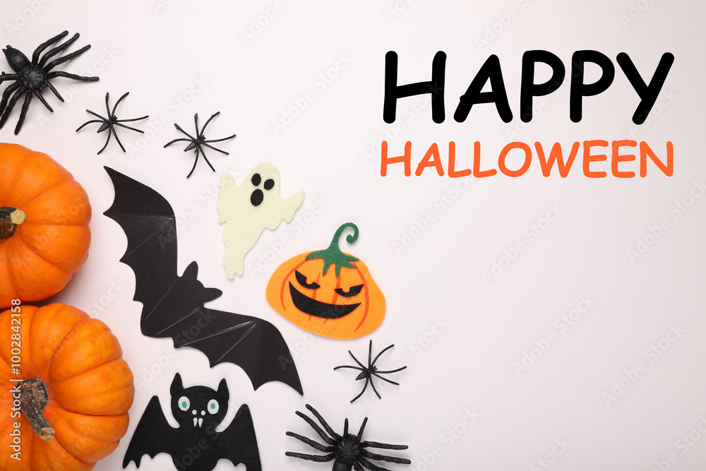 Happy Halloween text and spooky decor on white background, top view. Greeting card Happy Halloween text and spooky decor on white background, top view. Greeting card