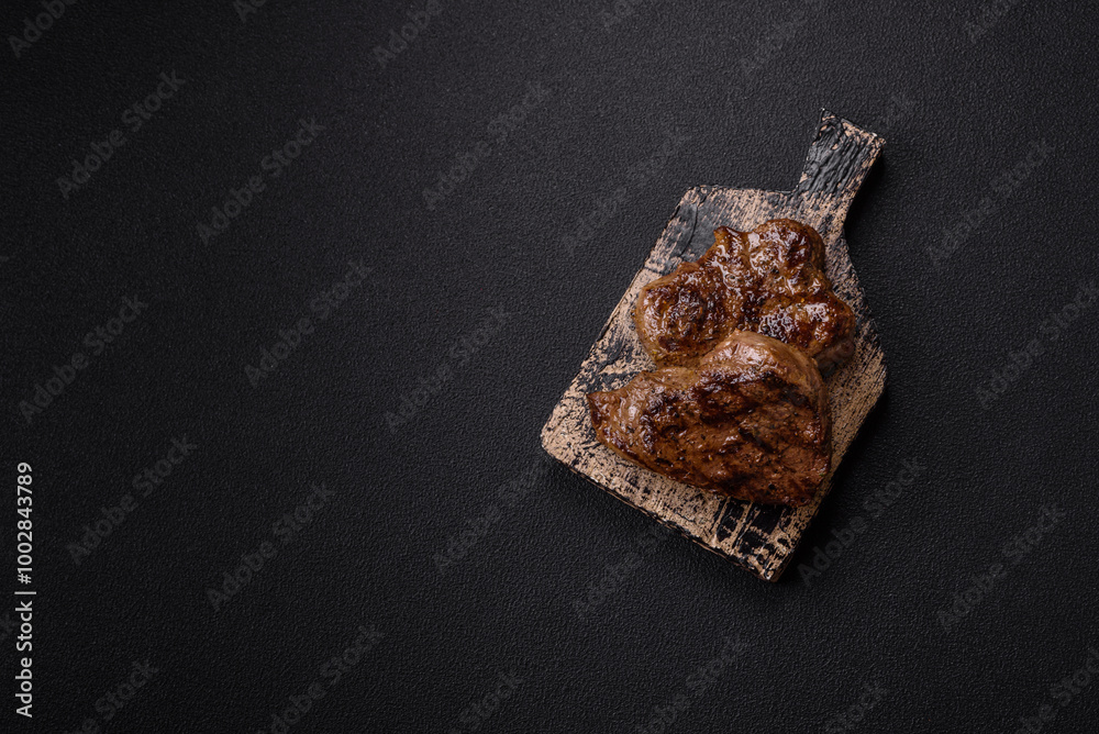 Juicy beef steak grilled with salt, spices and herbs Juicy beef steak grilled with salt, spices and herbs