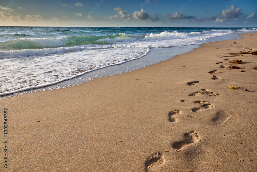 Early walK on a sandy beach finding peace where the ocean meets the sky. Delray Beach Florida Early walK on a sandy beach finding peace where the ocean meets the sky. Delray Beach Florida