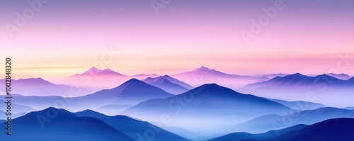 Misty mountain range at sunrise with pink and blue hues.