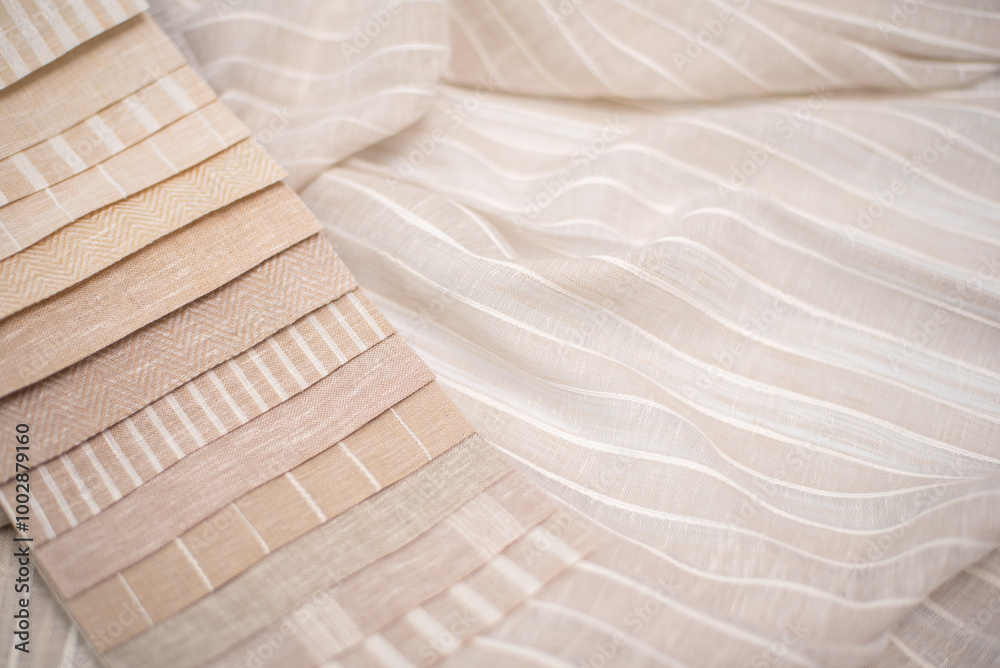 A palette of linen fabric with different stripes in beige tones. Fabric for curtains and tulles.