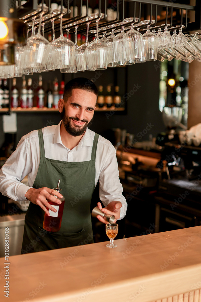 Fototapeta premium Skilled bartender prepares a cocktail at a stylish bar during a vibrant evening in a bustling city