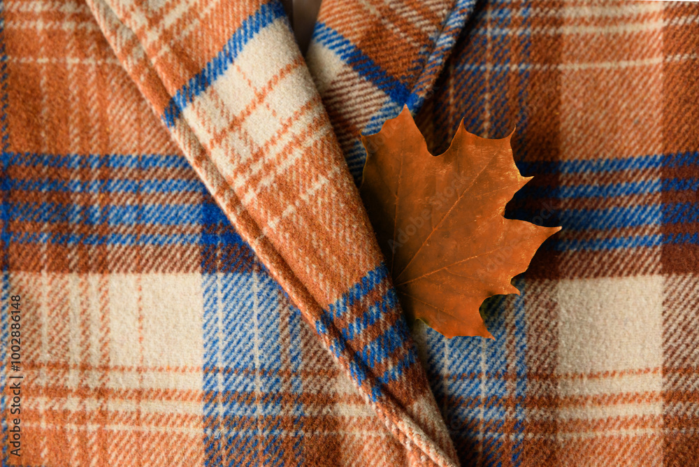 Autumn coat with maple leaf in pocket Autumn coat with maple leaf in pocket