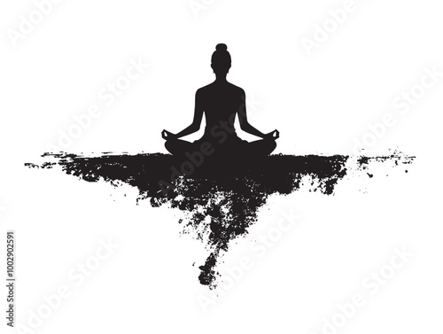 Silhouette of a person sitting cross-legged meditating 