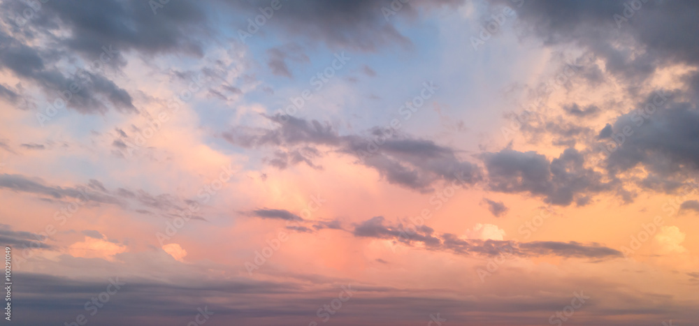 A beautiful pastel-colored evening sky with soft clouds illuminated by the warm light of the setting sun, creating a tranquil and serene atmosphere. A beautiful pastel-colored evening sky with soft clouds illuminated by the warm light of the setting sun, creating a tranquil and serene atmosphere.