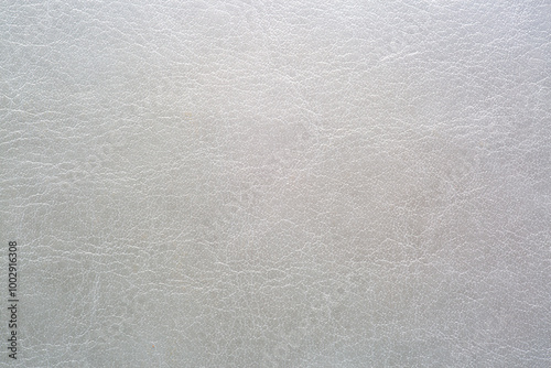 Gray macro synthetic leather,Natural, genuine gray leather texture close up, macro. Structure of glossy leatherette, artifical skin surface with embossing pattern. Background, wallpaper