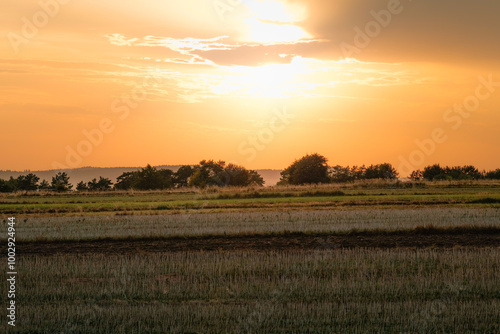 Obraz na płótnie Beautiful sunset over the field after harvest. Susiec, Roztocze, Poland w salonie
