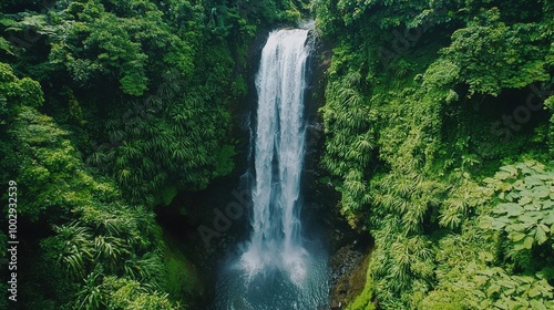 Magnificent Waterfall Cascading Through Lush Tropical Forest Landscape