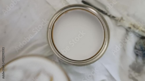white container against a clean background with a lid. The composition conveys a sense of freshness and simplicity, making it ideal for projects in health, cosmetics, and eco-friendly products.