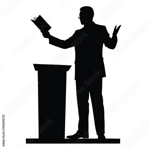 a black silhouette of a man standing at a podium. He is holding a book in his right hand and appears to be giving a speech or presentation 