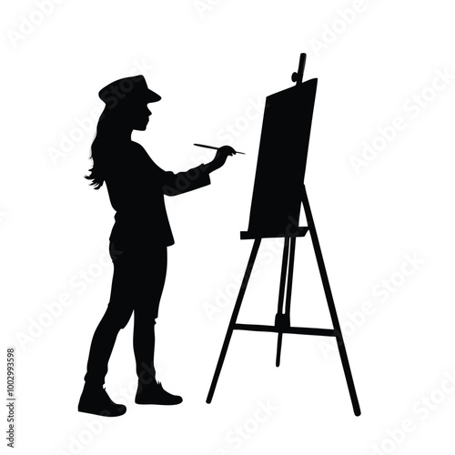 a black silhouette of a woman standing in front of an easel. She is holding a paintbrush in her right hand and appears to be in the process of painting or drawing on the canvas 