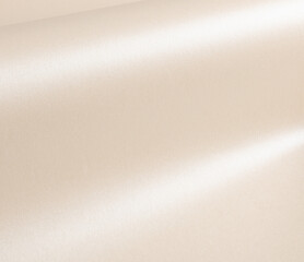 Beige paper with a smooth, glossy sheen and reflective folds. Elegant, minimal texture with a soft, luxurious surface, perfect for high-end stationery and creative design. The