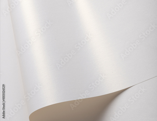 Sparkling and glittering white paper with a polished, silky surface. The bright, satiny texture features glowing, shiny gradients with chic, classy reflections. A modern, wavy photo