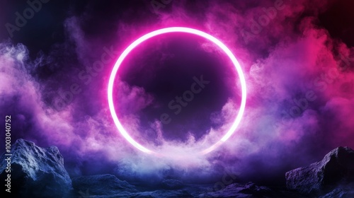 A colorful neon ring glows over dramatic mountains and clouds at night in a s...