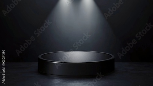 A darkened performance stage with focused overhead lights highlighting a circ...