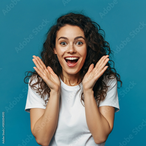 Excited Woman Expressing Joy and Surprise with Hands Up, Happy Young Woman Celebrating with Enthusiastic Expression