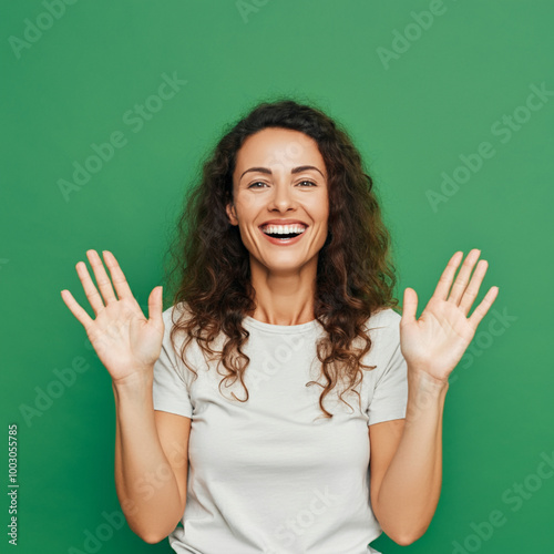 Excited Woman Expressing Joy and Surprise with Hands Up, Happy Young Woman Celebrating with Enthusiastic Expression