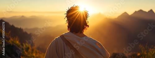 Jesus Christ with a crown of thorns on his head, seen from behind, looking at the sun in a mountainous landscape photo