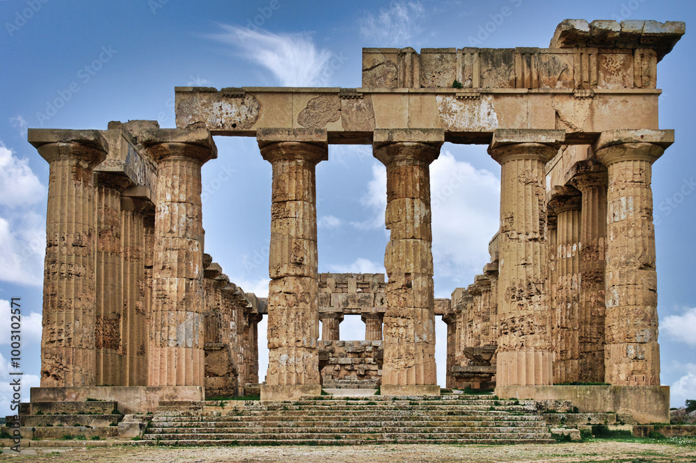 Front view of the Temple E It is one of the best preserved temples of the ancient Greek city of Selinunte, in Sicily. Dedicated to Hera, it is a Doric temple built in the 5th century BC. Front view of the Temple E It is one of the best preserved temples of the ancient Greek city of Selinunte, in Sicily. Dedicated to Hera, it is a Doric temple built in the 5th century BC.