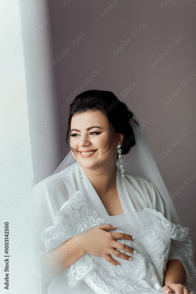 A woman in a wedding dress is smiling and holding a white blanket. Concept of happiness and celebration, as the woman is likely preparing for a wedding or a special event A woman in a wedding dress is smiling and holding a white blanket. Concept of happiness and celebration, as the woman is likely preparing for a wedding or a special event
