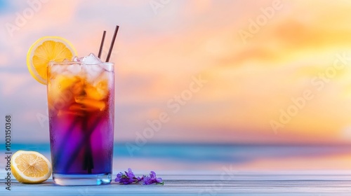 A vibrant cocktail with ice and a lemon slice, set against a beautiful sunset by the ocean photo