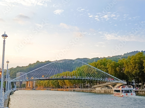 Zubizuri footbridge across Nervion river, Bilbao, Spain photo