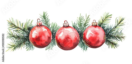 Vibrant red Christmas ornaments hanging on pine branches during the festive s...
