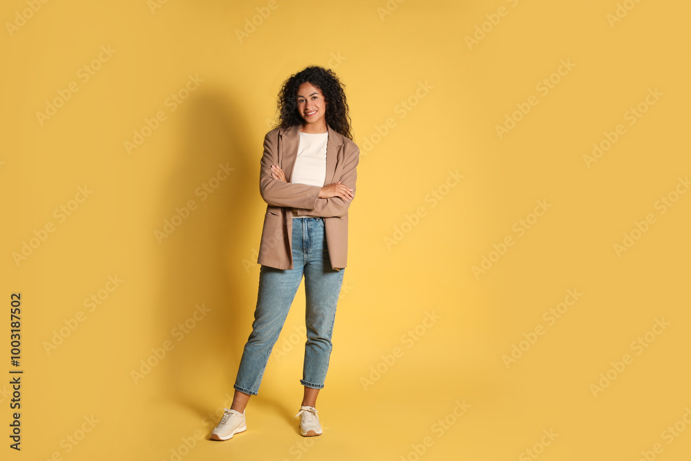 Beautiful woman in stylish jacket on yellow background Beautiful woman in stylish jacket on yellow background