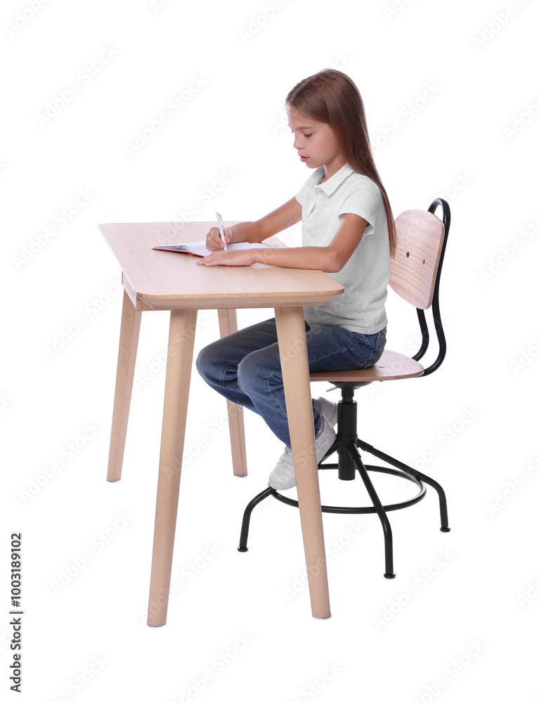 Girl with correct posture and notebook sitting at wooden desk on white background