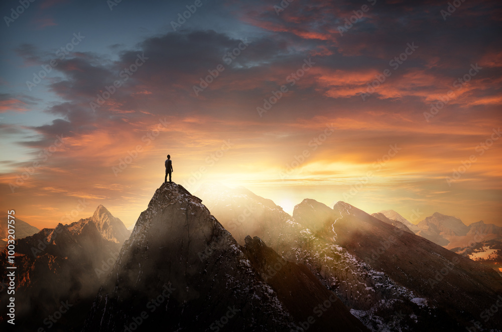 A man standing on top of a mountain at sunset. Goals, challenges and life achievements concept photo composite.