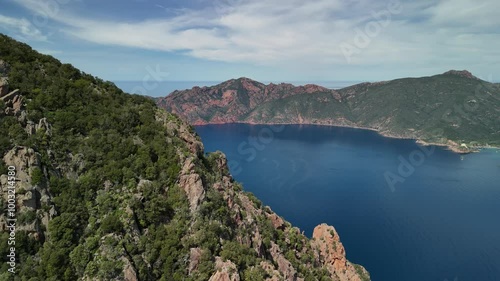 Discover the breathtaking cliffs and clear waters of Corsicas stunning coastline photo