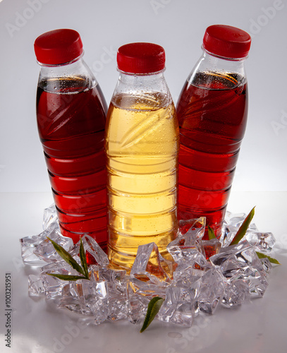 Three Bottles of Refreshing Iced Tea on White Background