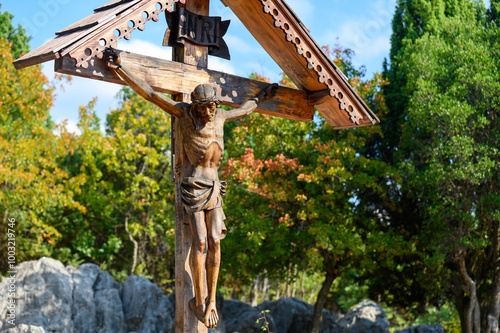 A wooden crucified Jesus on Mount Podbrdo, the Apparition Hill overlooking the village of Medjugorje in Bosnia and Herzegovina.