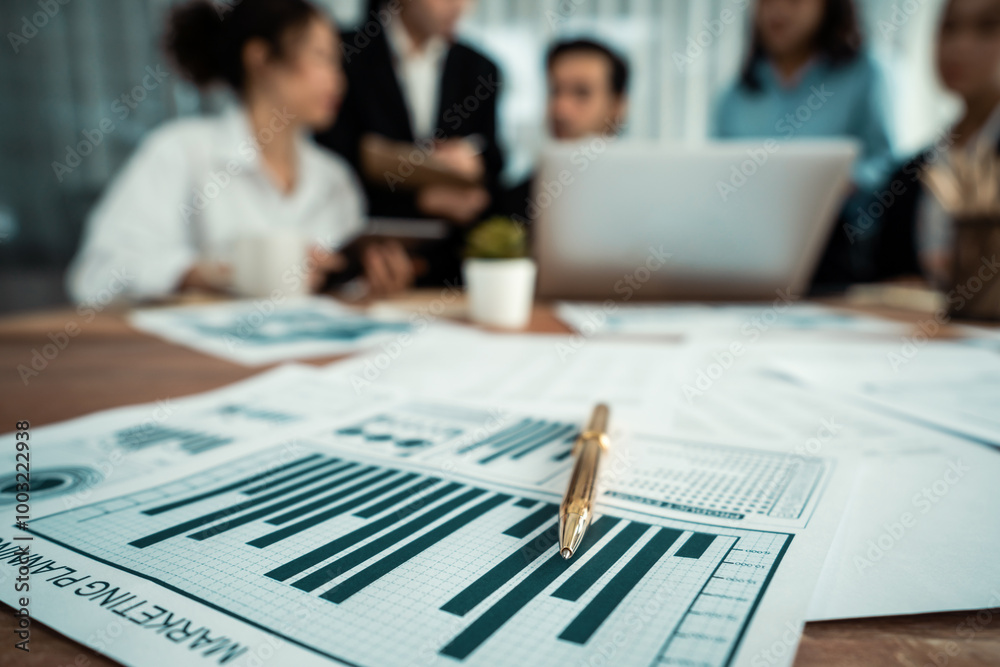 Piles of analyzed financial data dashboard on meeting table with background of business people analyzing data analysis market trend indication for strategic marketing investment plan. Habiliment