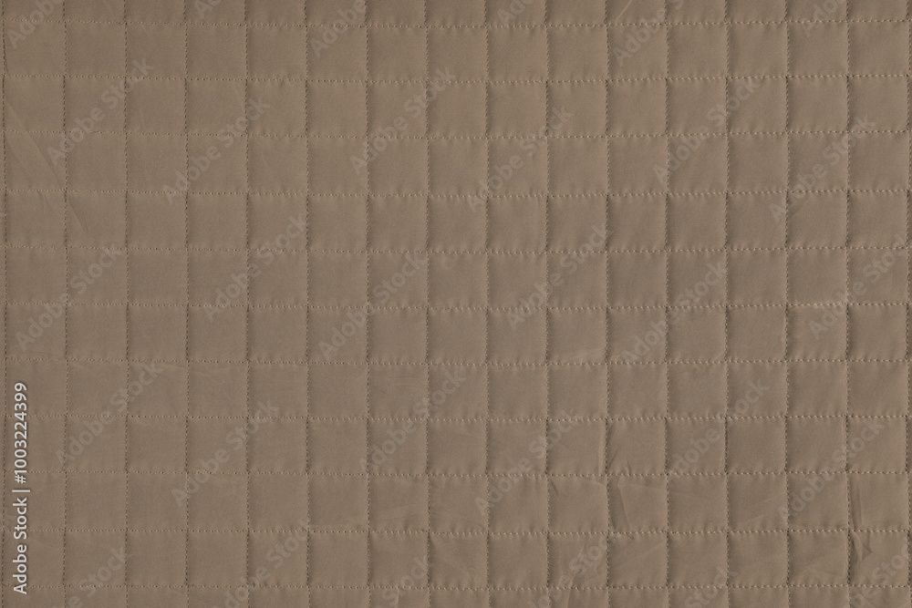 Naklejka premium Checkered stitching pattern, brown quilted fabric background. Blanket stitch square texture