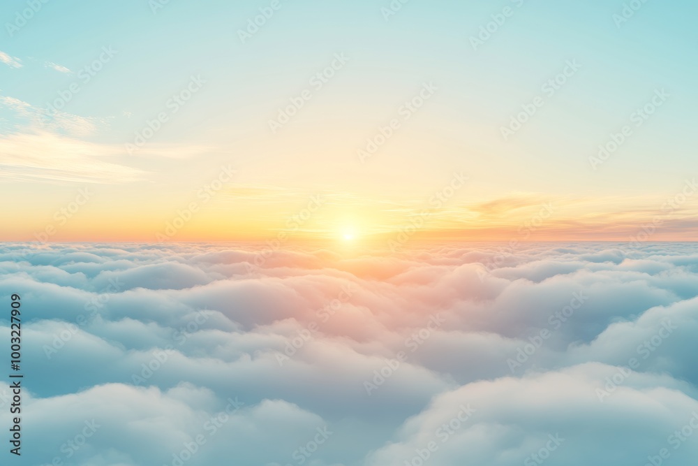 The yellow sunlight of the sun at sunrise or sunset, with soft blue clouds above the peak of a mountain, creates a beautiful scene The yellow sunlight of the sun at sunrise or sunset, with soft blue clouds above the peak of a mountain, creates a beautiful scene