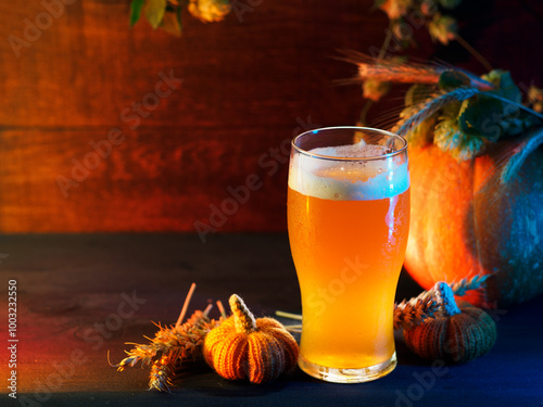 Seasonal craft beer . Ears of wheat, green hops and pumpkins on a wooden table. Copy space