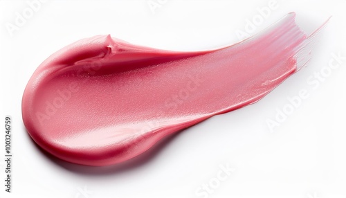 A layer of pink cosmetic cream is isolated on a white surface, emphasizing its soft texture and attractive color. 