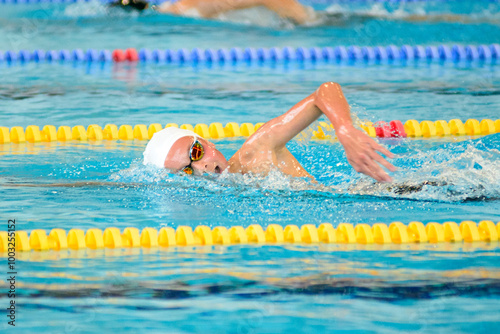 Swimmer swims freestyle swimming style in the pool